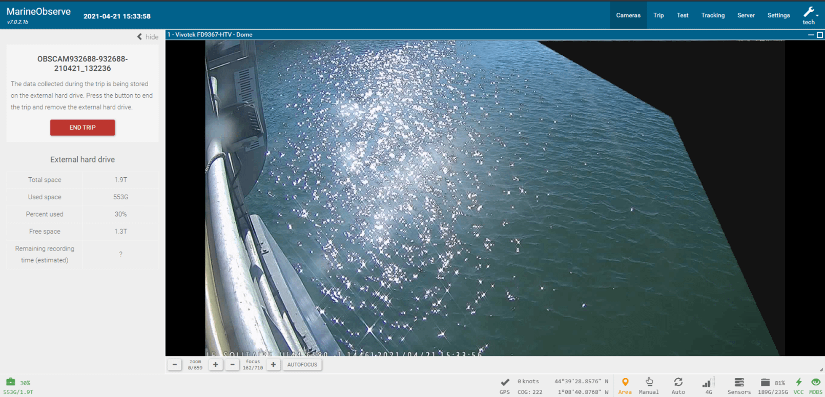 MarineObserve electronic monitoring interface showing live over-the-side camera view of sunlit water beside a fishing vessel, with trip status and external hard drive recording details displayed on the left panel.
