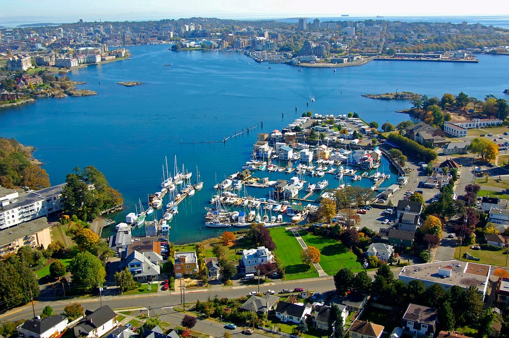 Aerial view of Victoria, BC harbour with marinas, waterfront homes, and Archipelago’s office near the shoreline.